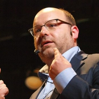 Gianluca Busato speaking at a technology event